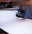 Moorpark insulation being installed in a crawl space.