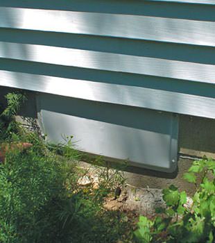 A gray crawl space vent cover in Goleta