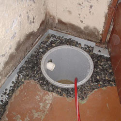 Installing a sump in a sump pump liner in a Santa Barbara home