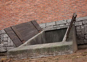 An open hatchway door in  that's flooded.