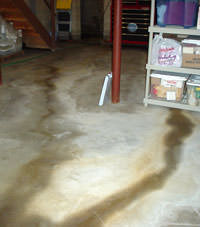 Flooding entering a basement through a floor crack in 