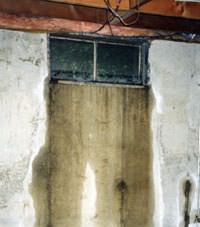 Flooding through basement windows in a  home.