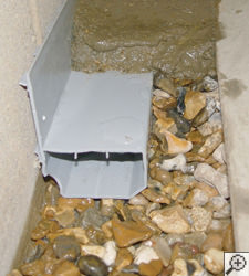 A no-clog basement french drain system installed in Newbury Park