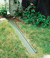A recessed gutter drain extension installed in , California